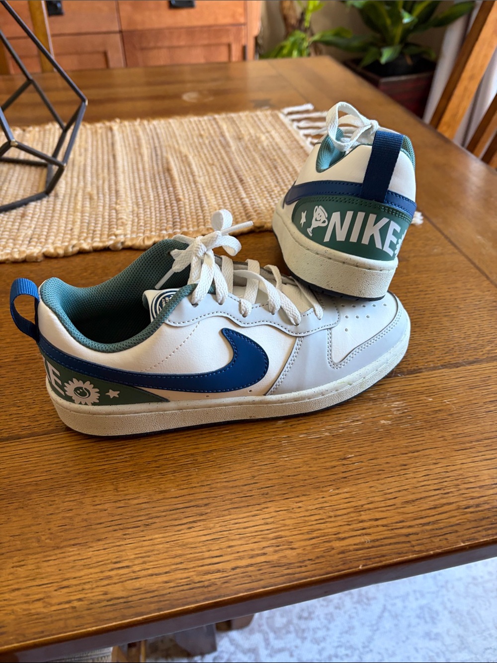 Nike Kids White Sneakers with Blue Swoosh and Green Heel